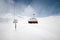 View from the outside of the aerial passenger line of a ski resort in winter in sunny weather against the backdrop of