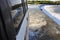 View outside window of offroad truck driving the Ivanhoe Crossing, Kununurra, Western Australia, Australia. A concrete causeway