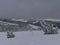 View over Black Forest in winter with deep snow and bizarre looking frozen coniferous trees on Schliffkopf peak.