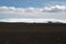 View over black wide endless black barren wasteland with snow capped mountains - Iceland