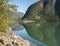 View over blue water of Sogndalsfjorden Fjord Sogndal in Norway, nature and travel background. Early autumn blue sky