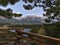 View over Bow Valley with the town of Canmore, Kananaskis Country, Canada through the branches of a tree and wooden railing.