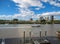 View over Brisbane River from Eagle Street pier with sailboats and CityCat catamaran passing and West