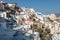View over the buildings in the cliffside of Oia, Santorini.