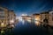 View over the Canal Grande to the illuminated cityscape of Venice, Italy