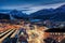 View over the cityscape of Innsbruck, Austria, to the train station and snow covered Alps