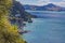 View over cliffy shore of Te Whanganui-A-Hei Marine Reserve on Northern island in New Zealand in summer