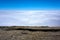 View over the clouds with rocks in the foreground