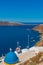 View over the coastline at Oia with traditional white houses, Santorini island, Greece