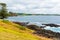 View over coastline, water waves and rocky shore in Kiama, NSW, Australia