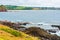 View over coastline, water waves and rocky shore in Kiama, NSW, Australia