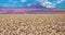 View over endless dry salt flat crust on blurred mountain range, volcano Licanabur - Salar de Atacama, Chile