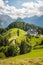 View over farm on hill Kamnikâ€“Savinja Alps in Slovenia