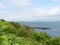 View over ferns at Moushole to the blue sea of the Cornish coast and Saint Michael\\\'s Mount Cornwall England