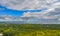 View over forests on the island of RÃ¼gen, on dramatic clouds towering over the water