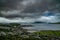 View over Greenock town with the river Clyde and mountains in the background on a gloomy day