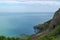 View over Irish sea in Wicklow, Ireland, with rail tunnel through cliff in foreground
