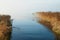 View over the lake Flyndersoe in Denmark , with mist laying over the calm water