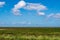 View over the marshland to the north sea, wonderful blue sky with white clouds, near Greetsiel