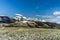 View over a meadow to the snowy Churfirsten mountains in the Swiss Alps, Toggenburg, Switzerland