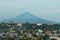 View over Medan city with volcano in the background, Sulawesi, Indonesia