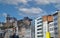 View over modern cityscape on medieval church saint martin on hill against blue sky