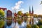 View over the Muehlenteich pond to the buildings and Cathedral of Luebeck at the Baltic Sea, Schleswig-Holstein