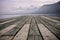 View over an old bathing jetty onto a mountain lake.