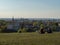 View over old town of Cracow from Krakus mound. In the front people relaxing on the grassland.