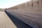 View over parched and empty dam, with cracked mud