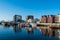 View over the port and quayside of Svolvaer on the Lofoten islands in colorful early morning sunrise in winter with snow