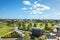 View over a public park with many residential houses in the distance.