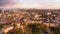 View over the red roofs and medieval wall of the old city. Sunset. Panorama. Aerial drone video footage.