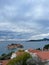 View over the red tiled roofs of houses on the island of Sveti Stefan in the Bay of Kotor