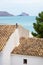 View over the roof of traditional Spanish house to the ocean and the rock of Calpe, Altea, Costa Blanca, Spain