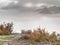 View over sandstone edge into heavy  autumnal mist