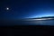View over the sea at dusk with the Moon, Jupiter, Saturn and Venus