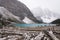 View over the shore of the blue moraine lake covered with snow in banff national park, Canada