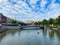 View over water canal on bridge against blue summer sky, konig pilsener arena background