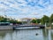 View over water canal on bridge against blue summer sky, konig pilsener arena background