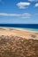 View over a wide beautiful bathing bay on the Canary Island Fuerteventura in the Atlantic Ocean , vertical photo