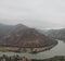 View overview from the city of Vardzia city of Queen Tamara Georgia high mountain and river at the foot in cloudy weather