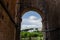 View of Palatine Hill Rome through archway