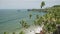 View of a Palm tress and rocky seashore of Arabian Sea