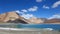 View of Pangong Lake with snow and frozen water at the shore