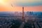 View of Paris with Eiffel Tower from Montparnasse building. Eiffel tower view with flying birds from Montparnasse at sunset, view