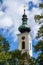 View of the parish and pilgrimage church Maria Attersee  tower in Attersee on