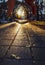 View of the Park alley with walkers and tourists through a glass ball at sunset in Stavropol, Russia