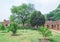 A view of the park, the ancient fortress wall and the old mosque of Isa Khan`s near Humayun Tomb, Delhi. India
