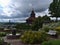 View of park area at historic castle in Esslingen am Neckar, Germany with bench, fountain, flowers and old tower.